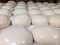 Pizza dough balls at pizzeria waiting to be transformed into a pizza by a chef cook in the oven background image