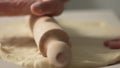 Pizza Dough Crafting on Wooden Surface.