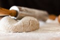 Pizza dough on the table with more products to make the pizza