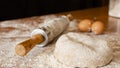 Pizza dough on the table with more products to make the pizza