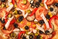 Pizza with eggplant, ham, red pepper, tomato,cucumber, olives and corn isolated on white background Royalty Free Stock Photo