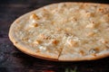 Pizza four cheeses on a wooden board in a restaurant Royalty Free Stock Photo