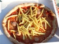 pizza with french fries and wurstel mozzarella cheese and tomato Royalty Free Stock Photo
