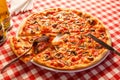 Pizza with ham and mushrooms. Delicious hot food sliced and served on white platter. Menu photo, Italian fast food. Royalty Free Stock Photo