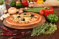 Pizza with ham, mushrooms and olives Royalty Free Stock Photo