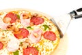 Pizza with ham, mushrooms, salami and pesto sauce Royalty Free Stock Photo
