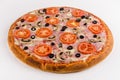 Pizza ham, mushrooms, tomatoes on a white background. Royalty Free Stock Photo