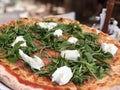 Pizza with ham, ruccola and cream cheese