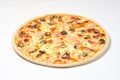 Pizza with ham and Sun-dried tomatoes on a white background