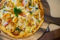 Pizza Hawaii on the wood dish Royalty Free Stock Photo