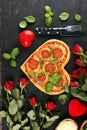 Pizza Heart shaped margherita with tomatoes and mozzarella vegetarian. Food concept of romantic love pizza for Valentines Day