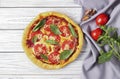 Pizza with ingredients on white table Royalty Free Stock Photo