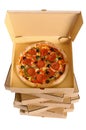 Pizza inside open box on tall stack of delivery boxes isolated on a white background, top view Royalty Free Stock Photo