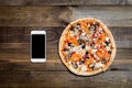 Pizza, Italian food delivery, call or order online on mobile, cellular, smart phone. Royalty Free Stock Photo