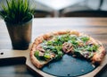 Pizza on wooden plate . Royalty Free Stock Photo