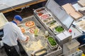 Pizza maker preparing a delicious fragrant pizza view from above