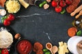 Pizza making ingredients frame against a dark background Royalty Free Stock Photo