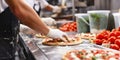 Pizza making process. Male chef hands making authentic pizza in the pizzeria kitchen. Pizza Art. The process of making pizza.