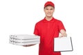 Pizza man at work. Young cheerful pizza man holding a stack of p