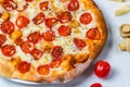 Pizza margarita. Cheese and tomato on background. White cloth Royalty Free Stock Photo