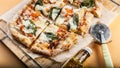 Pizza Margherita with basil on a cutting board. Close-up. Horizontal shot. Orange background