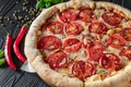 Pizza Margherita on black background, top view. Pizza Margarita with Tomatoes, Basil and Mozzarella Cheese