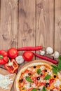 Pizza Margherita or Margarita with Mozzarella cheese, tomato, olive. Italian pizza on wooden background Royalty Free Stock Photo