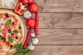 Pizza Margherita or Margarita with Mozzarella cheese, tomato, olive. Italian pizza on wooden background Royalty Free Stock Photo