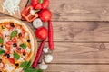 Pizza Margherita or Margarita with Mozzarella cheese, tomato, olive. Italian pizza on wooden background Royalty Free Stock Photo