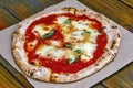 Pizza Margherita on rustic wooden table Royalty Free Stock Photo