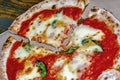 Pizza Margherita on rustic wooden table Royalty Free Stock Photo