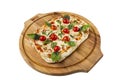 Pizza margherita with tomatoes and basil served on a wooden board. Traditional dish of Italian cuisine. Top view. Close-up. Royalty Free Stock Photo