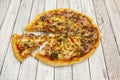 Pizza with minced meat, red peppers, slices of smoked bacon, tomato Royalty Free Stock Photo