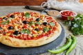 Pizza with minced meat tomato cheese corn olives Royalty Free Stock Photo