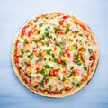 Pizza with mozzarella cheese, chicken, sweet corn, sweet pepper and parsley on blue wooden background top view Royalty Free Stock Photo