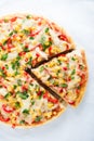 Pizza with mozzarella cheese, chicken, sweet corn, sweet pepper and parsley on white background top view Royalty Free Stock Photo