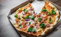 Pizza with Mozzarella cheese, onion, tuna fish, tomato sauce, pepper, basil. Italian pizza in the delivery cardboard box on wooden Royalty Free Stock Photo