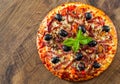 Pizza with Mozzarella cheese, salami, pepper, ham, pepperoni, olives, Spices and Fresh Basil. Italian pizza Royalty Free Stock Photo