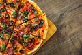 Pizza with Mozzarella cheese, salami, pepper, pepperoni, Tomatoes, olives, Spices and Fresh Basil. Italian pizza Royalty Free Stock Photo