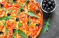 Pizza with Mozzarella cheese, Tomatoes, pepper, olive, Spices and Fresh arugula. Italian pizza. Pizza Margherita or Margarita Royalty Free Stock Photo