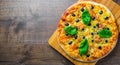 Pizza with Mozzarella cheese, Tomatoes, pepper, olive, Spices and Fresh Basil. Italian pizza. Pizza Margherita or Margarita on woo Royalty Free Stock Photo