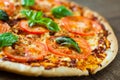 Pizza with Mozzarella cheese, Tomatoes, pepper, Spices and Fresh Basil. Italian pizza. Pizza Margherita or Margarita. Royalty Free Stock Photo