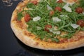 beautiful closeup pizza image and mozzarella, fresh tomatoes, arugula, grana. austria, vienna - 25 April 2023: