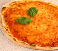 Pizza with mozzarella and tomato and fresh basil leaves in the I Royalty Free Stock Photo