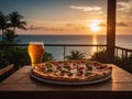 A pizza and mug of beer served on a balcony with ocean beach sunset view. Ideal for food, dining, and sunset relaxation concepts