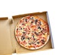 Pizza with mushrooms, cheese and ham in a carton box isolated on white background. Top view Royalty Free Stock Photo