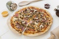 Pizza with mushrooms, ham, oregano, made with thin dough Royalty Free Stock Photo