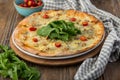 Pizza with mushrooms and walnut-grained cheese