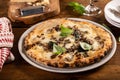 Pizza Napolitana or Naples style with cheese, mushrooms and basil