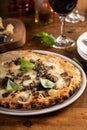 Pizza Napolitana or Naples style with cheese, mushrooms and basil